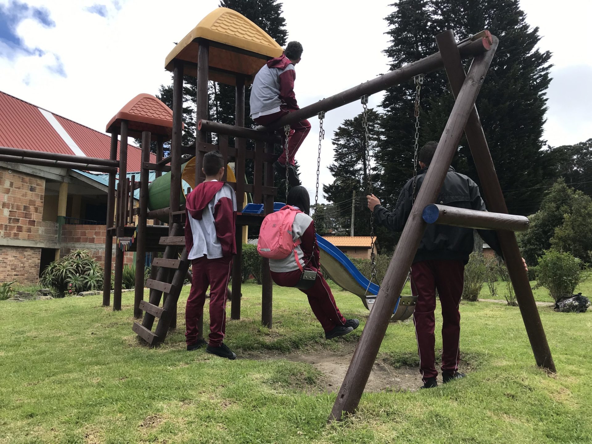 Former child combatants at the playground at Benposta, a refuge for child survivors of conflict and a project partner.